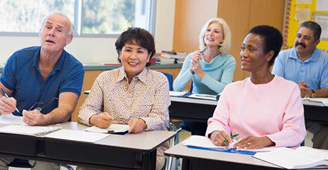 A group of adults in a classroom
